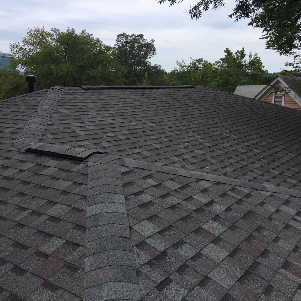 Close-up of dark architectural shingles after a roof repair in Benton AR