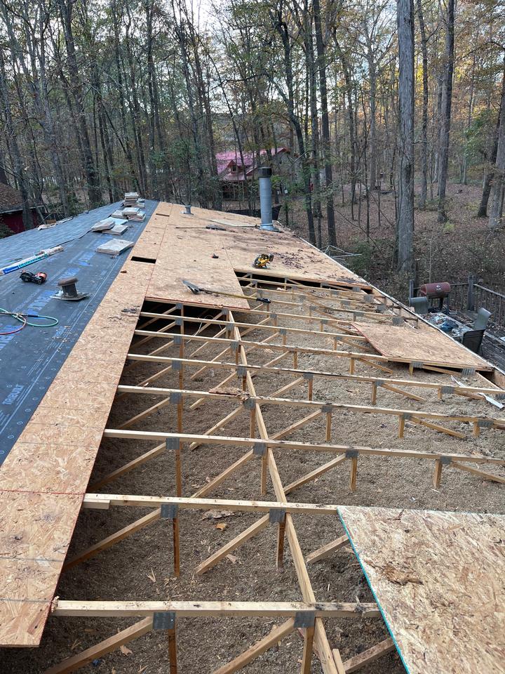 Old shingles torn off down to the decking during a roof replacement in Benton AR
